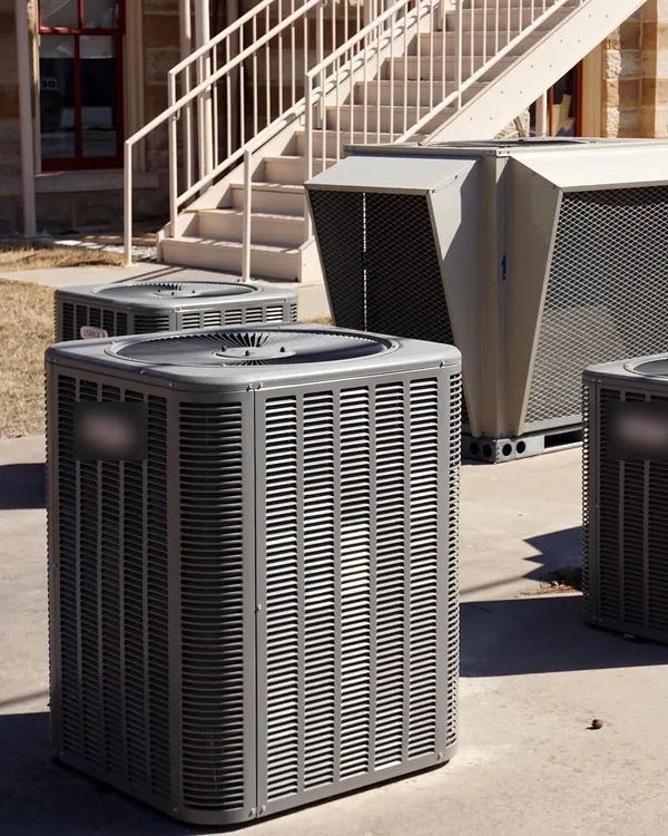 Outdoor heat-pump units beside an office building