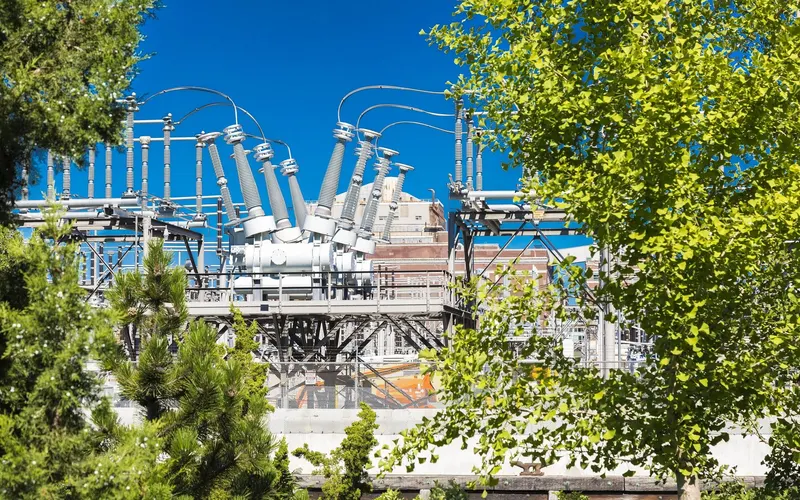 Electrical substation framed by trees