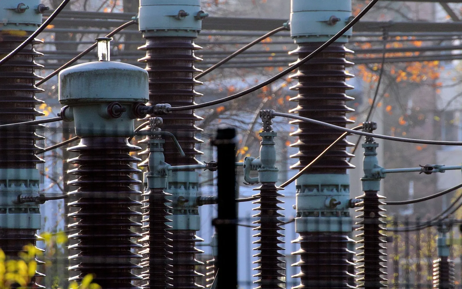 High-voltage bushings and insulators at an electrical substation
